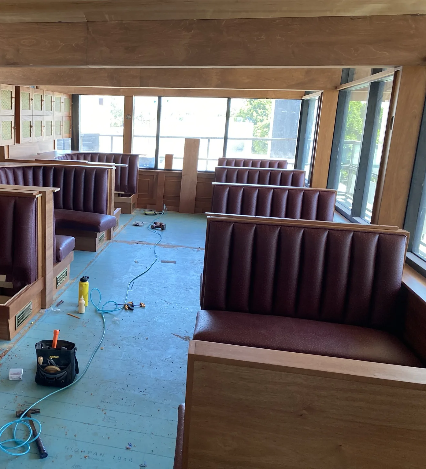 Restaurant booth seating and wall millwork during installation